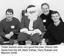 These doctors were very good this year. Shown with Santa from the left: Mark Vrahas, Harry Rubash and Malcolm Smith